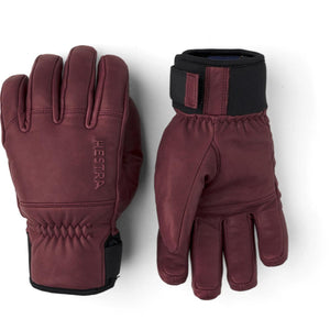 Hestra burgundy leather ski gloves with black velcro wrist straps