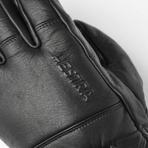 Black Hestra leather glove with embossed logo
