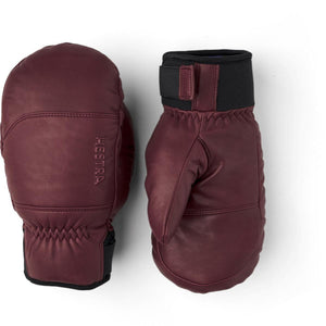 Hestra burgundy leather mittens with black wrist cuffs