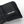Black Hestra glove cuff with adjustable velcro strap and white logo