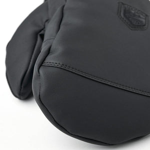 Close up of black Hestra leather mitten