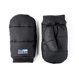 Black quilted mittens with grey knit cuffs and a small mountain graphic patch