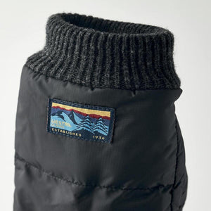 Black Hestra glove cuff with ribbed knit top and Hestra brand mountain logo patch