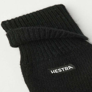 Black Hestra ribbed knit glove with folded cuff and brand label