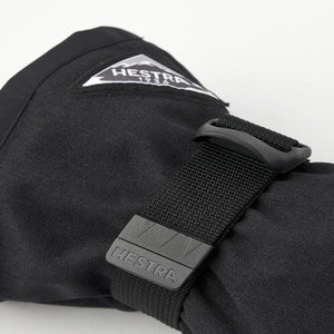 Black Hestra glove cuff with adjustable strap and Hestra logo patch