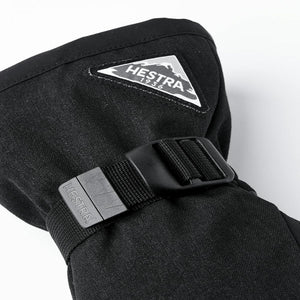 Black Hestra glove cuff with adjustable strap and triangular brand logo