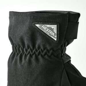 Black Hestra glove cuff with triangular brand logo patch