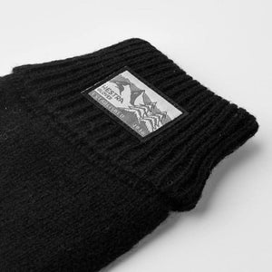 Black ribbed knit Hestra glove cuff with brand logo patch