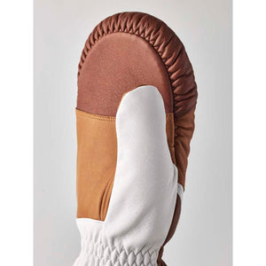 Brown and white leather mitten with gathered stitching