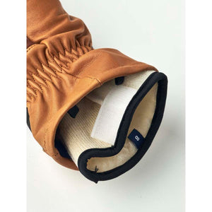 Hestra tan leather glove cuff with size 8 label and velcro closure