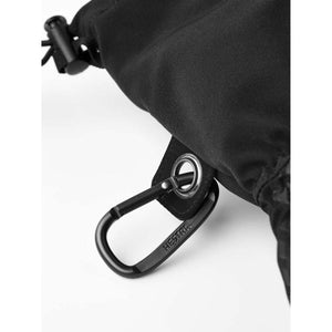 Black Hestra carabiner attached to a black fabric glove cuff