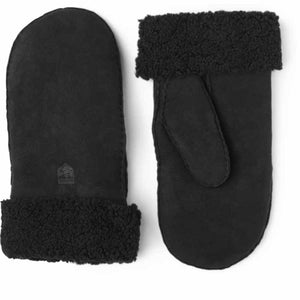 Black Hestra sheepskin mittens with a curly wool cuff