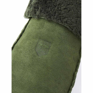 Close up of olive green Hestra suede mitten with shearling cuff