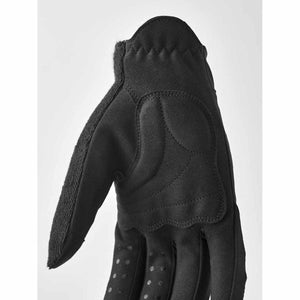 Black Hestra glove showing palm padding and textured grip detail
