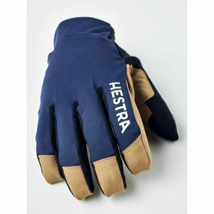 Hestra navy blue glove with tan leather fingertips and logo