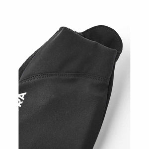 Close up of black fabric sleeve cuff with partial white logo text