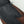 Close up of black and brown leather Hestra glove with embossed logo
