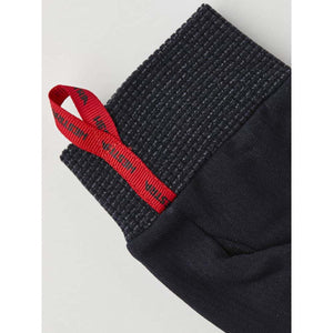 Hestra glove cuff with ribbed texture and red branded pull tab