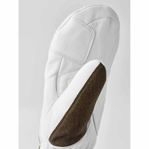 White leather mitten with a brown textured thumb panel