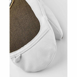 Close up of white leather and brown fabric Hestra mitten