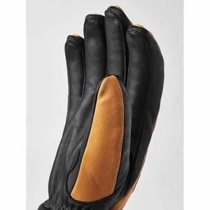 Hestra black and tan leather glove side view