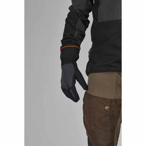 Person wearing black Hestra gloves with orange trim detail
