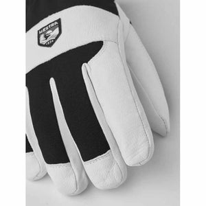 Hestra black and white leather ski glove with brand logo patch
