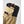Close up of tan and black glove cuff with velcro strap and pull tab