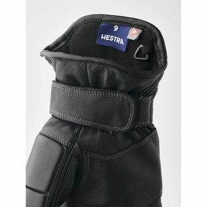 Black Hestra leather glove cuff with velcro strap and size nine label