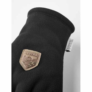 Black Hestra fleece glove with Gore-Tex Infinium label and Hestra logo patch