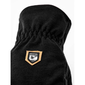 Black Hestra glove with elasticated wrist and branded leather patch