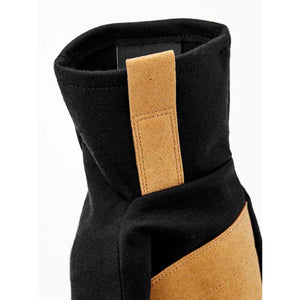 Black Hestra glove cuff with tan suede pull tab