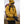 Person wearing a yellow jacket and Hestra black gloves outdoors