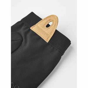 Hestra black glove cuff with tan suede pull tab