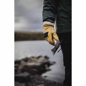 Person wearing Hestra leather work glove holding a small hand axe by a lake