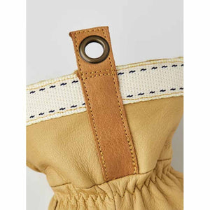 Hestra glove cuff detail with leather pull tab and metal eyelet