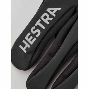 Black Hestra glove with reflective brand logo