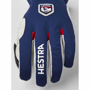 Blue Hestra glove with white logo patch and Hestra text on the middle finger