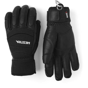 Pair of black Hestra leather ski gloves with velcro wrist straps and carabiner attachment
