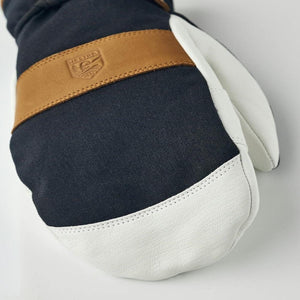 Hestra navy and white leather mitten with tan leather strap detail