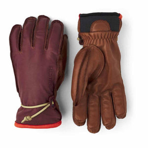 Hestra leather gloves in burgundy and brown with wrist adjustment cords