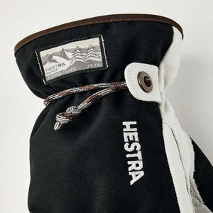 Hestra black and white glove cuff with drawstring and logo patch