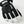 Hestra black and white ski glove with wrist drawstring and brand logo