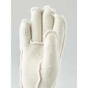 Off white knit glove with exposed seams