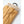 Tan leather Hestra glove with a ribbed knit cuff and black carabiner