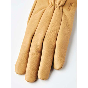 Tan Hestra leather glove with embossed logo