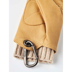 Tan Hestra leather glove with a ribbed knit cuff and attached metal carabiner