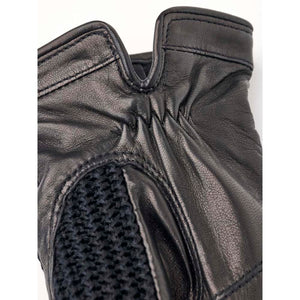 Close up of black Hestra leather glove with knitted detail