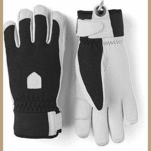 Hestra black and white leather gloves with adjustable wrist straps