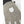 Close up of Hestra glove with textured grey fabric and brand logo patch